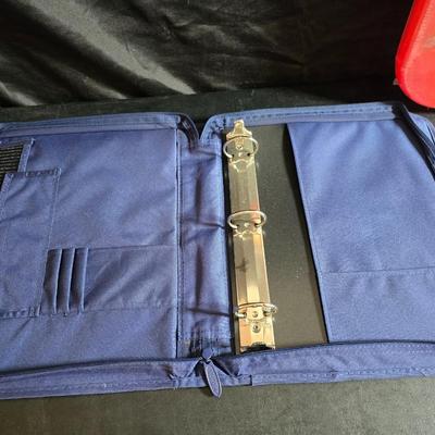 Home office or school supplies - binders - wall clock - clipboard - and an assortment of other office / school supplies.