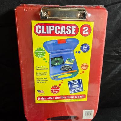 Home office or school supplies - binders - wall clock - clipboard - and an assortment of other office / school supplies.