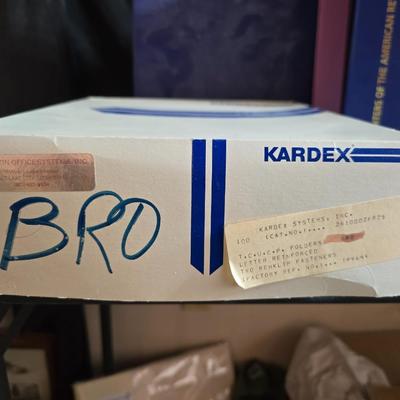 Home office or school supplies - binders - wall clock - clipboard - and an assortment of other office / school supplies.