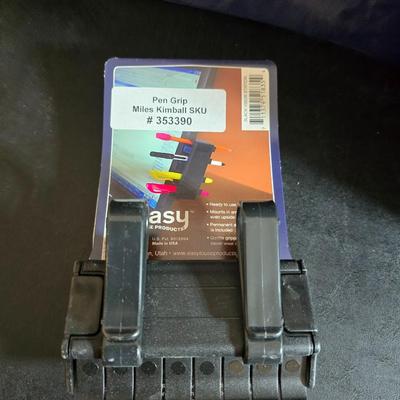 Home office or school supplies - binders - wall clock - clipboard - and an assortment of other office / school supplies.