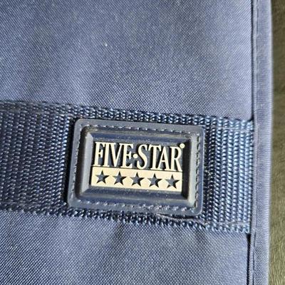 Home office or school supplies - binders - wall clock - clipboard - and an assortment of other office / school supplies.