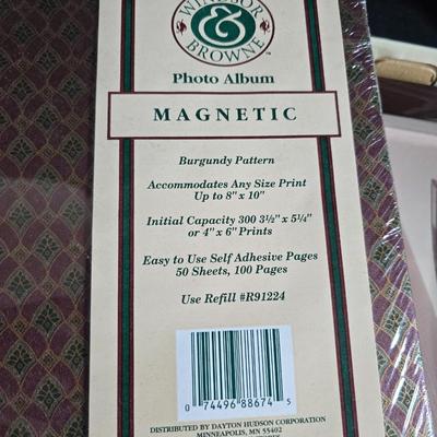 Four brand new matching picture frames with magnetic photo album and two candle holders