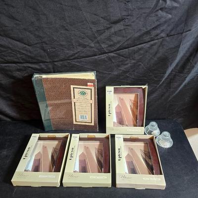 Four brand new matching picture frames with magnetic photo album and two candle holders