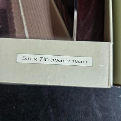 Four brand new matching picture frames with magnetic photo album and two candle holders