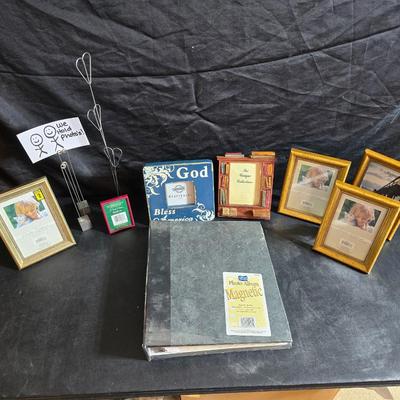 A variety of picture frames and a magnetic photo album