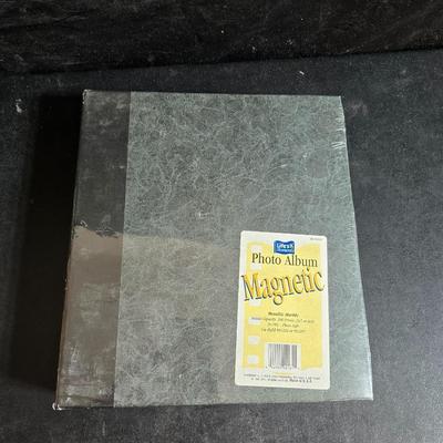 A variety of picture frames and a magnetic photo album