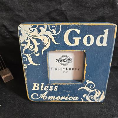 A variety of picture frames and a magnetic photo album