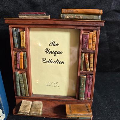 A variety of picture frames and a magnetic photo album