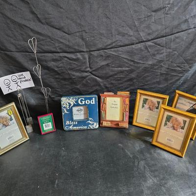 A variety of picture frames and a magnetic photo album