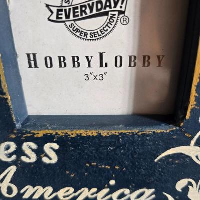 A variety of picture frames and a magnetic photo album