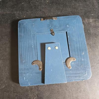 A variety of picture frames and a magnetic photo album