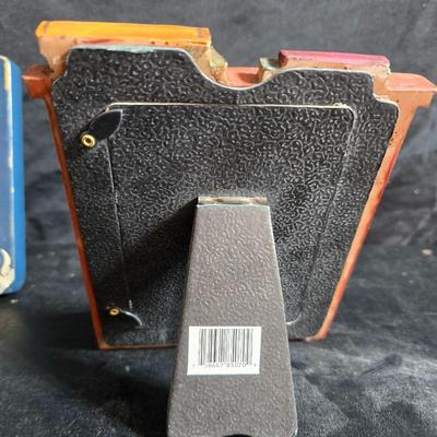 A variety of picture frames and a magnetic photo album