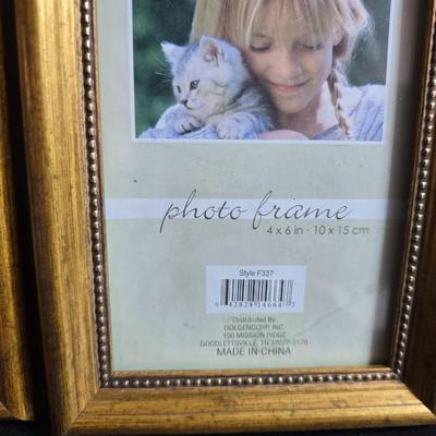 A variety of picture frames and a magnetic photo album