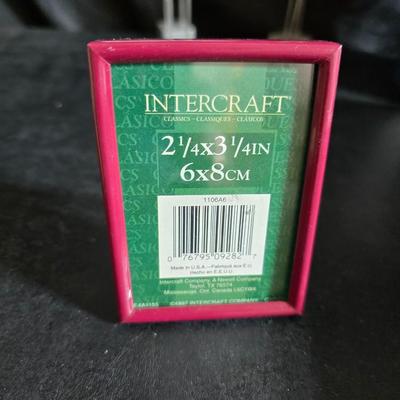 A variety of picture frames and a magnetic photo album