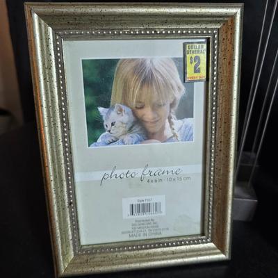 A variety of picture frames and a magnetic photo album