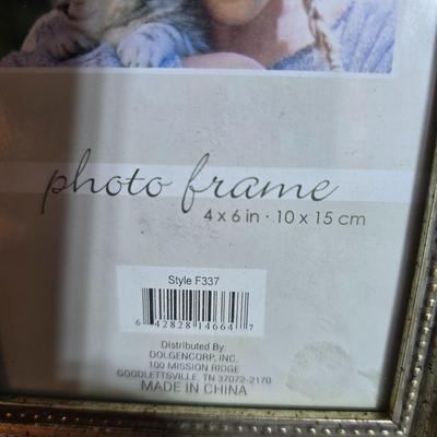 A variety of picture frames and a magnetic photo album