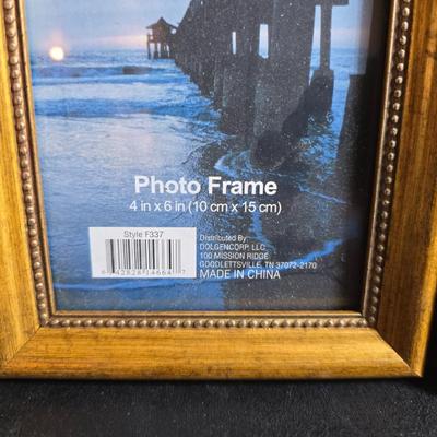 A variety of picture frames and a magnetic photo album