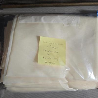 New curtain rods with sheer curtain panels and a new one rod pocket panel