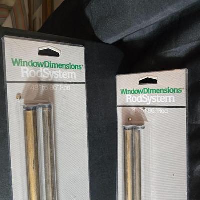 New curtain rods with sheer curtain panels and a new one rod pocket panel