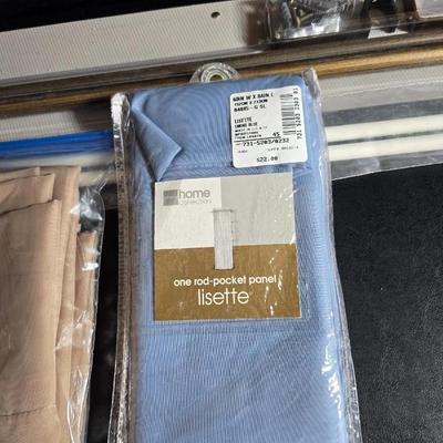 New curtain rods with sheer curtain panels and a new one rod pocket panel