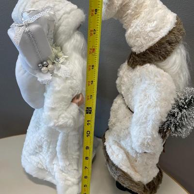 Two white fur coat Santa’s decor