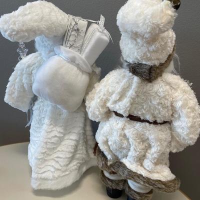 Two white fur coat Santa’s decor