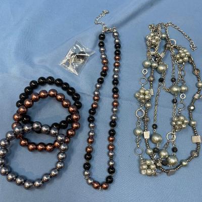 Sale Photo Thumbnail #169: Don't know the maker.  The little baggie has matching earrings.