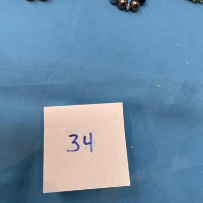 Sale Photo Thumbnail #168: Don't know the maker.  The little baggie has matching earrings.