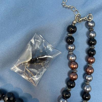 Sale Photo Thumbnail #173: Don't know the maker.  The little baggie has matching earrings.