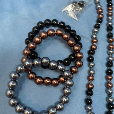 Sale Photo Thumbnail #170: Don't know the maker.  The little baggie has matching earrings.