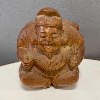 hand-carved wooden sculpture of Daikokuten