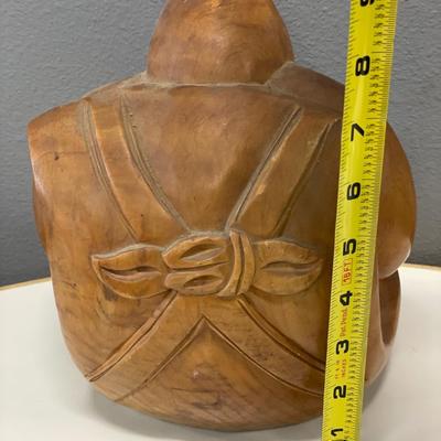 hand-carved wooden sculpture of Daikokuten