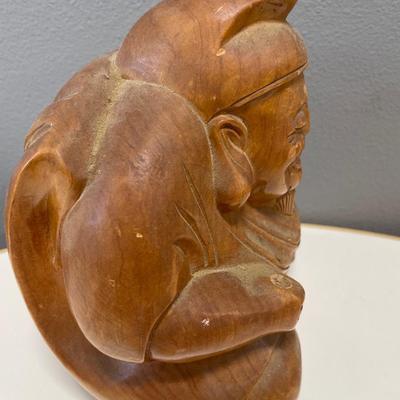 hand-carved wooden sculpture of Daikokuten