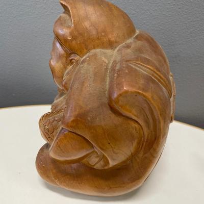 hand-carved wooden sculpture of Daikokuten