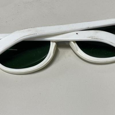 Vintage plastic sunglasses in zipper case