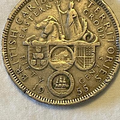 1955 EASTERN CARIBBEAN STATES 50 CENT COIN. 1988 CANADIAN “LOONIE” ONE DOLLAR COIN