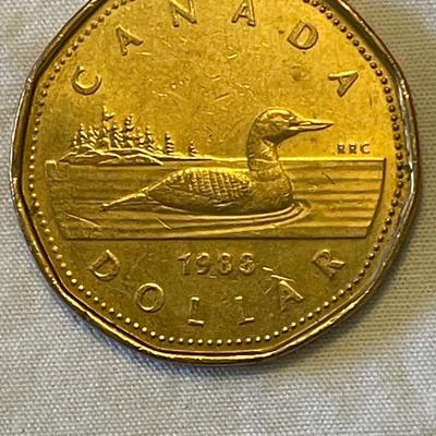 1955 EASTERN CARIBBEAN STATES 50 CENT COIN. 1988 CANADIAN “LOONIE” ONE DOLLAR COIN