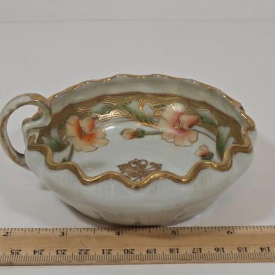 LOT 49: Round Table with Tablecloth, Lamp, Hen Feathers Bud Vase, and Hand-Painted Nippon Trinket Bowl