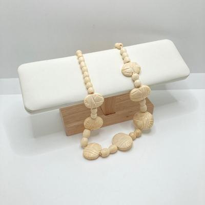 LOT 80: Egyptian Collection - Carved Bone Necklace, Fathi Mahmoud Mug and Stamps