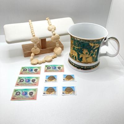 LOT 80: Egyptian Collection - Carved Bone Necklace, Fathi Mahmoud Mug and Stamps