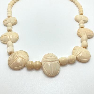 LOT 80: Egyptian Collection - Carved Bone Necklace, Fathi Mahmoud Mug and Stamps