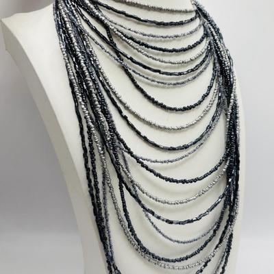 LOT 84: Ali Khan New York Multi Strand Black & Grey Beaded Necklace, Beaded Rope Necklace w/Tassels, Silver Tone Statement Necklace...