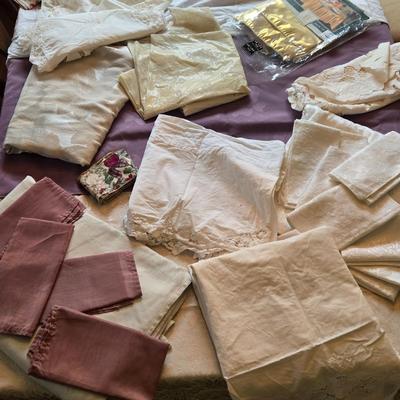 LOT 150: Linens Including Rectangle Tablecloths, Small Round Table Clothes, Table Scarves, Napkins, and More