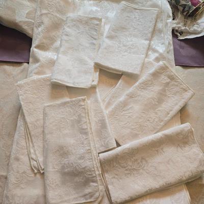 LOT 150: Linens Including Rectangle Tablecloths, Small Round Table Clothes, Table Scarves, Napkins, and More