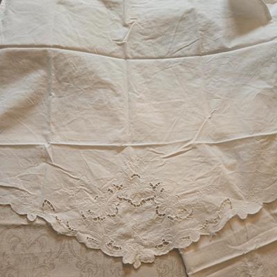 LOT 150: Linens Including Rectangle Tablecloths, Small Round Table Clothes, Table Scarves, Napkins, and More