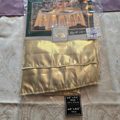 LOT 150: Linens Including Rectangle Tablecloths, Small Round Table Clothes, Table Scarves, Napkins, and More