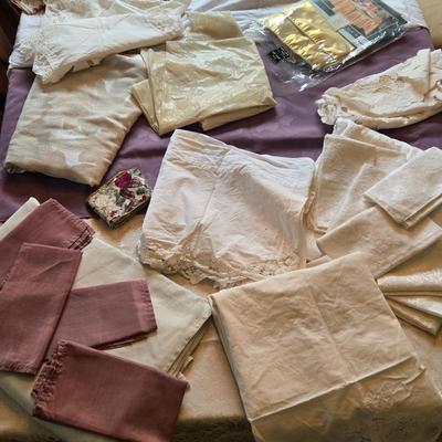 LOT 150: Linens Including Rectangle Tablecloths, Small Round Table Clothes, Table Scarves, Napkins, and More