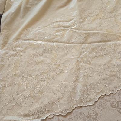 LOT 150: Linens Including Rectangle Tablecloths, Small Round Table Clothes, Table Scarves, Napkins, and More