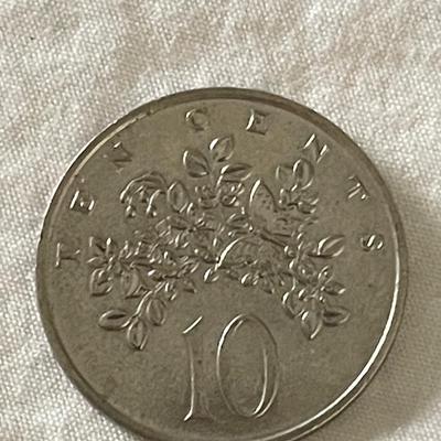 1979 CANADIAN QUEEN ELIZABETH II QUARTER. 1986 JAMAICAN TEN CENT COIN