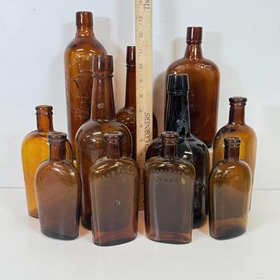 LOT 28: Vintage Brown Glass Flasks & Bottles